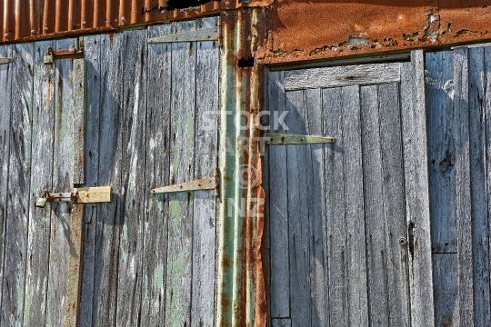 Closeup of old boat shed doors - Aged wood and rusty iron - Rangitoto Island, Auckland, New Zealand