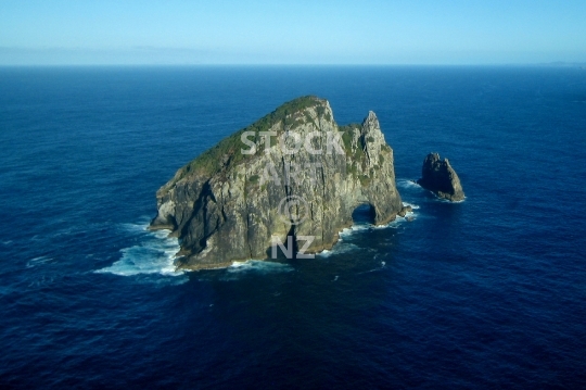 Hole in the rock from the air - Bay of Islands, NZ - Aerial view of the famous landmark in Northland, also Motukokako or Piercy Island, a spectacular rock outcrop in the ocean - lower resolution photo