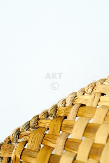 NZ flax weaving background - rim of a pikau - The whiri or edge of a woven backpack