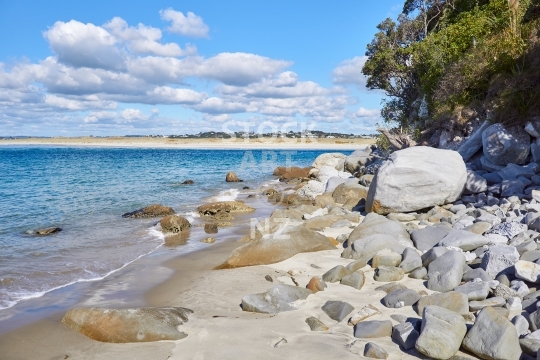 Rocky Mangawhai Heads beach with the sandspit in the background