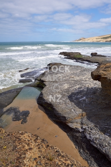 Waimamaku Beach rocks - Hokianga, Northland, New Zealand - Rockpools with a view to the giant sand dunes 